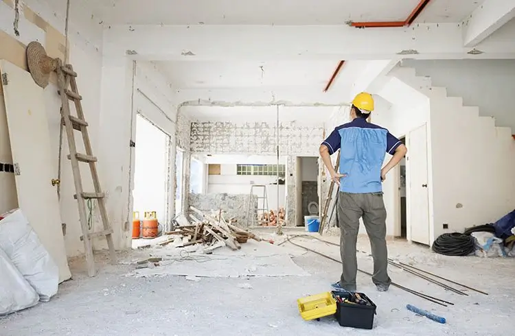 Builder assessing renovation site for Builders Queenstown's Renovations Queenstown service.