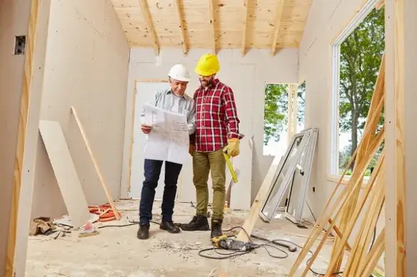 Contractors reviewing plans for Builders Queenstown's Renovations Queenstown projects.