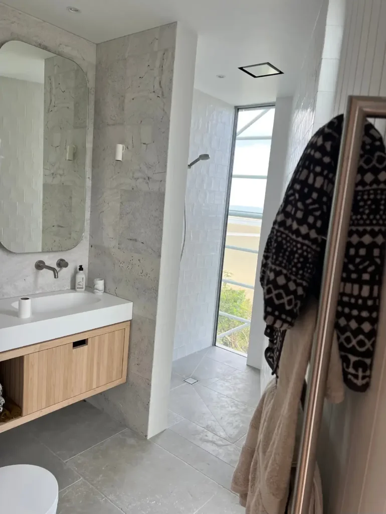 Modern bathroom renovation with glass shower doors and sleek fixtures by Bathroom renovations Queenstown.