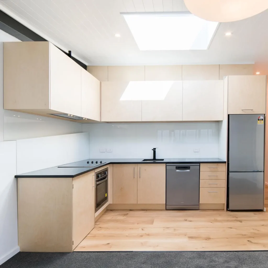 Bright, modern kitchen renovation with wooden flooring by Kitchen Renovations Queenstown.